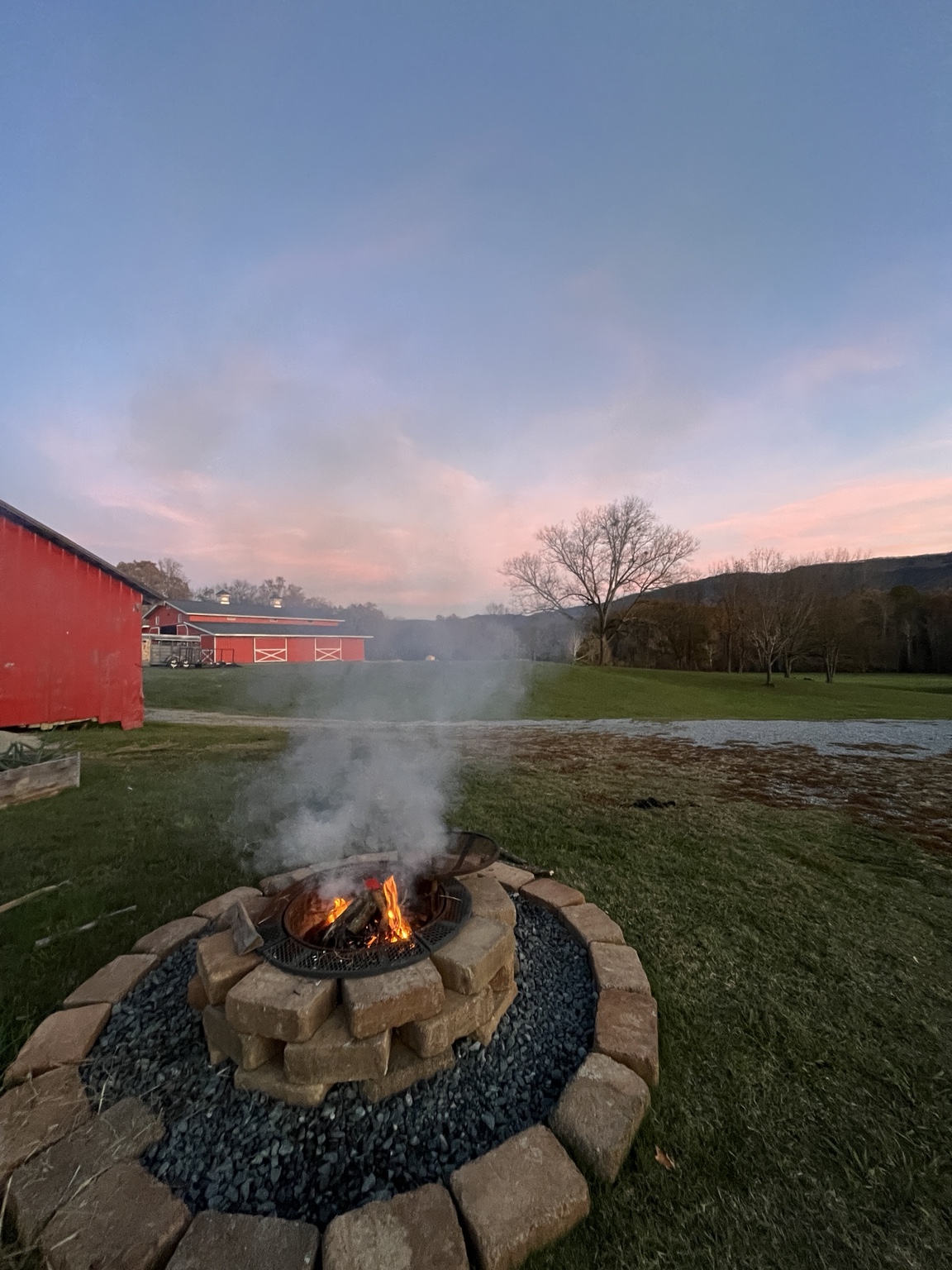Firepit near the barns at sunset